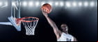 Player jumping toward the hoop with the ball