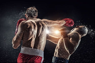 A boxer knocks out his opponent.