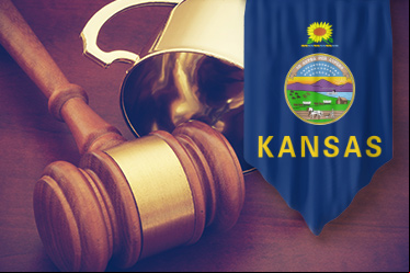 Flag with Kansas state symbol, gold trophy, and judge's gavel