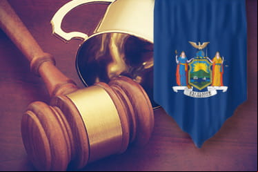A judge's gavel and the Great Seal of the State of New York.