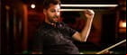 A snooker player celebrating.